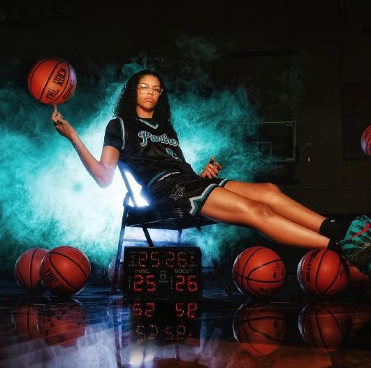 Basketball media day portrait with teal lighting and smoke